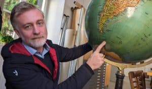 In the old map room of the Masaryk University’s geographical department, Daniel Nývelt, Head of the Programme, is showing the location of Czech Antarctic Research Programme’s Antarctic base. Photo: Ole Ellekrog