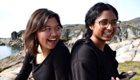 Two of the Arctic Resilient Comunities Youth Fellows enjoying a break at the beach in Sisimiut, Greenland. Photo: ARCYF