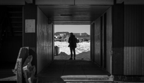 Homelessness in the Arctic comes with extra challenges. To avoid hypothermia, people inflicted by homelessness often have to stay in stairwells, like this one in the town of Sismiut. Photo: Piitannguaq Egede at Unsplash
